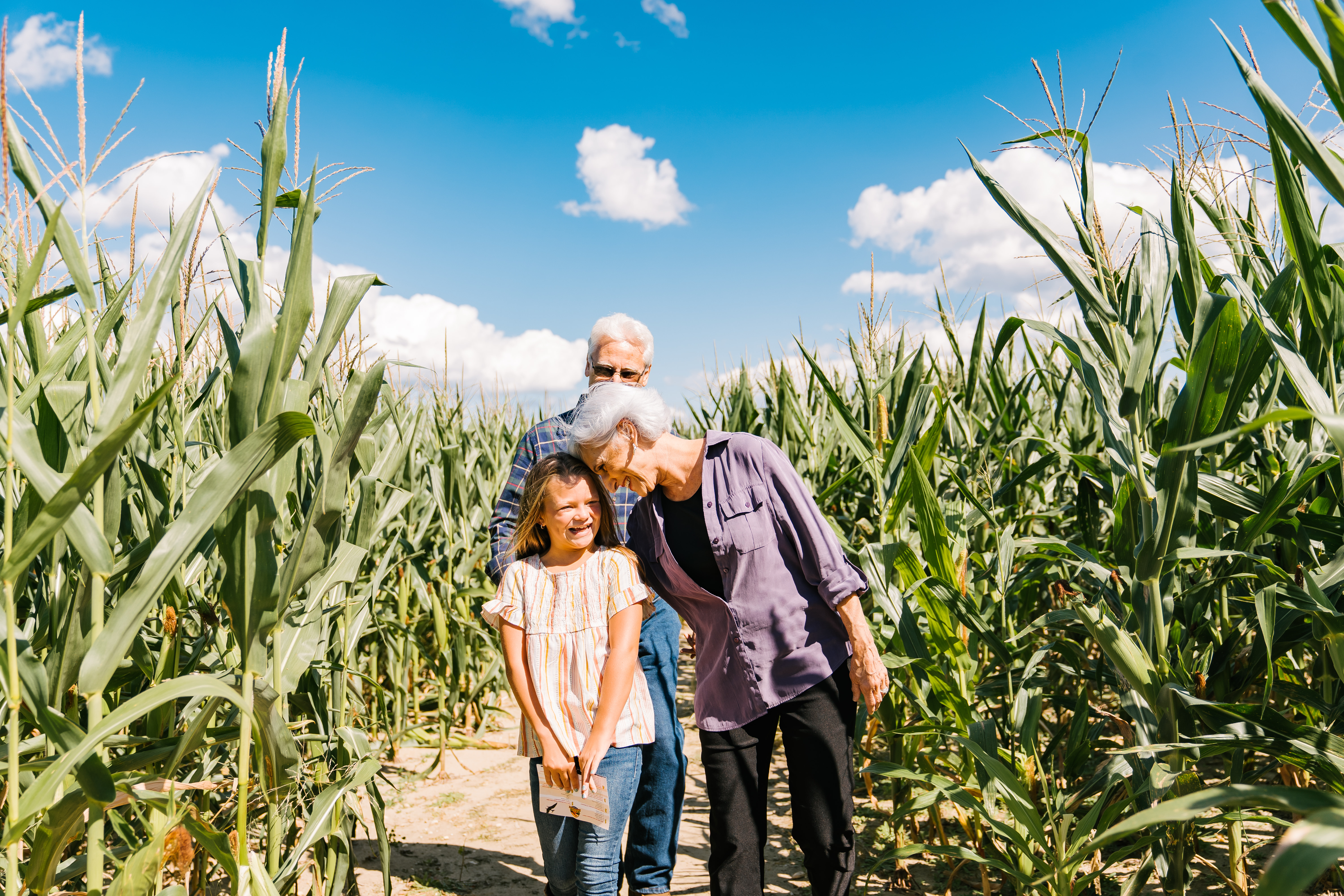 Family-Walking-Through-Corn-Maze