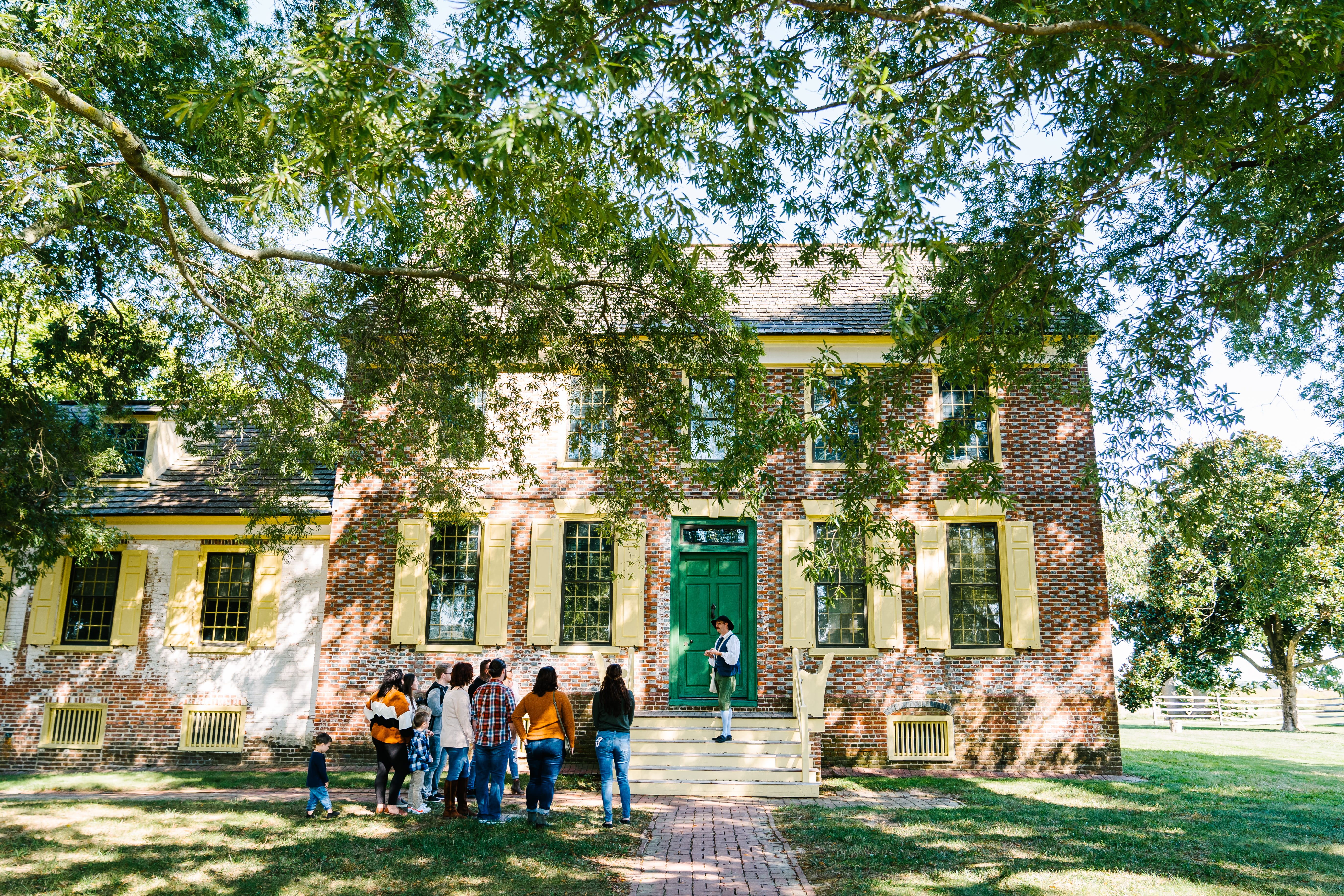 Group getting tour of colonial house